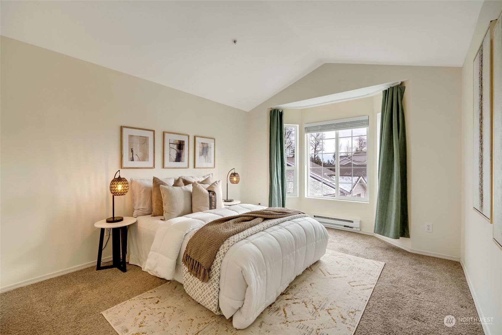 Curved track curtains for the primary bedroom bay window w/ vaulted ceilings