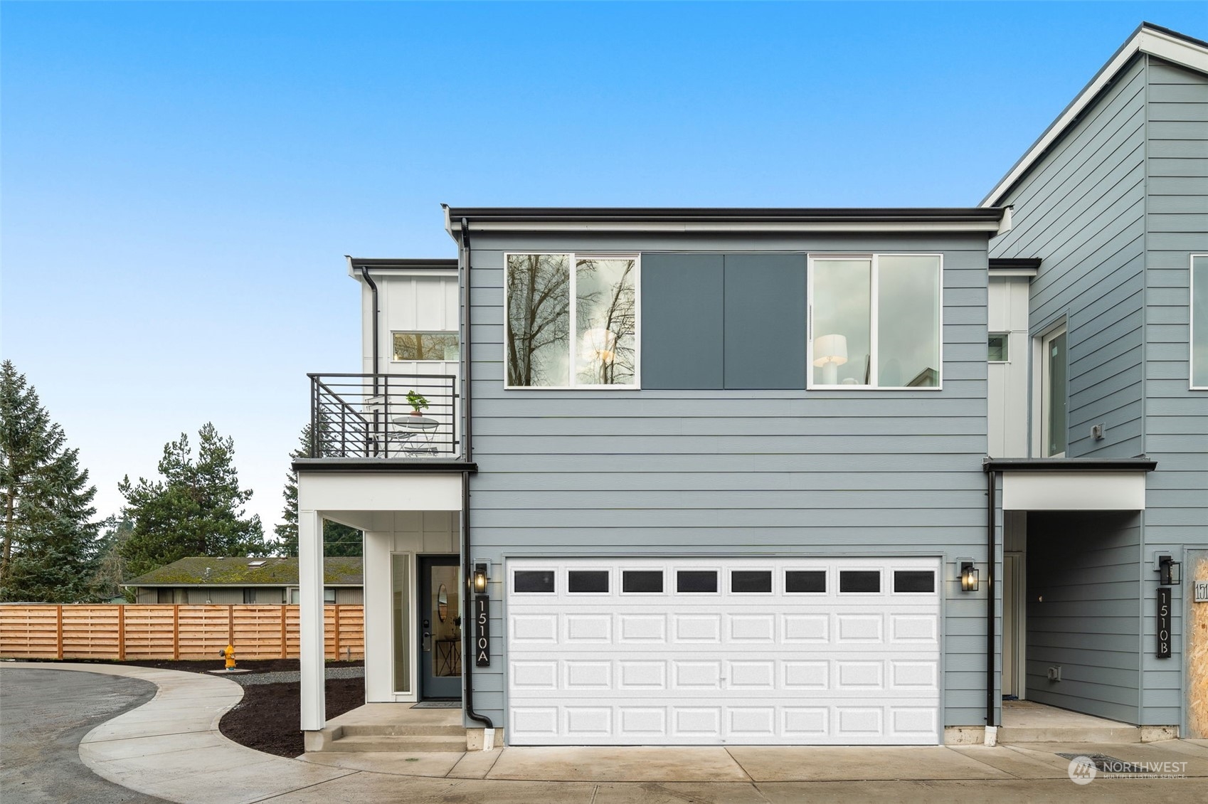 A glimpse inside our model home! This open-concept layout seamlessly connects the living, dining, and kitchen areas, creating a space perfect for entertaining or relaxing.