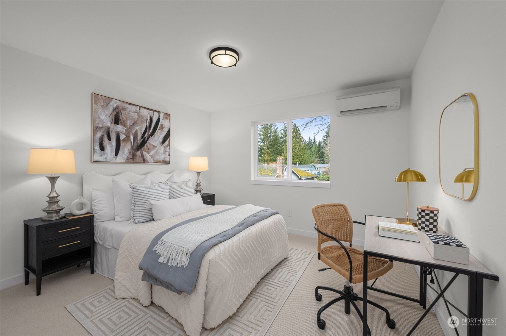 Charm and comfort meet in this cozy model home's bedroom. The clean design and ample natural light make it an inviting retreat.