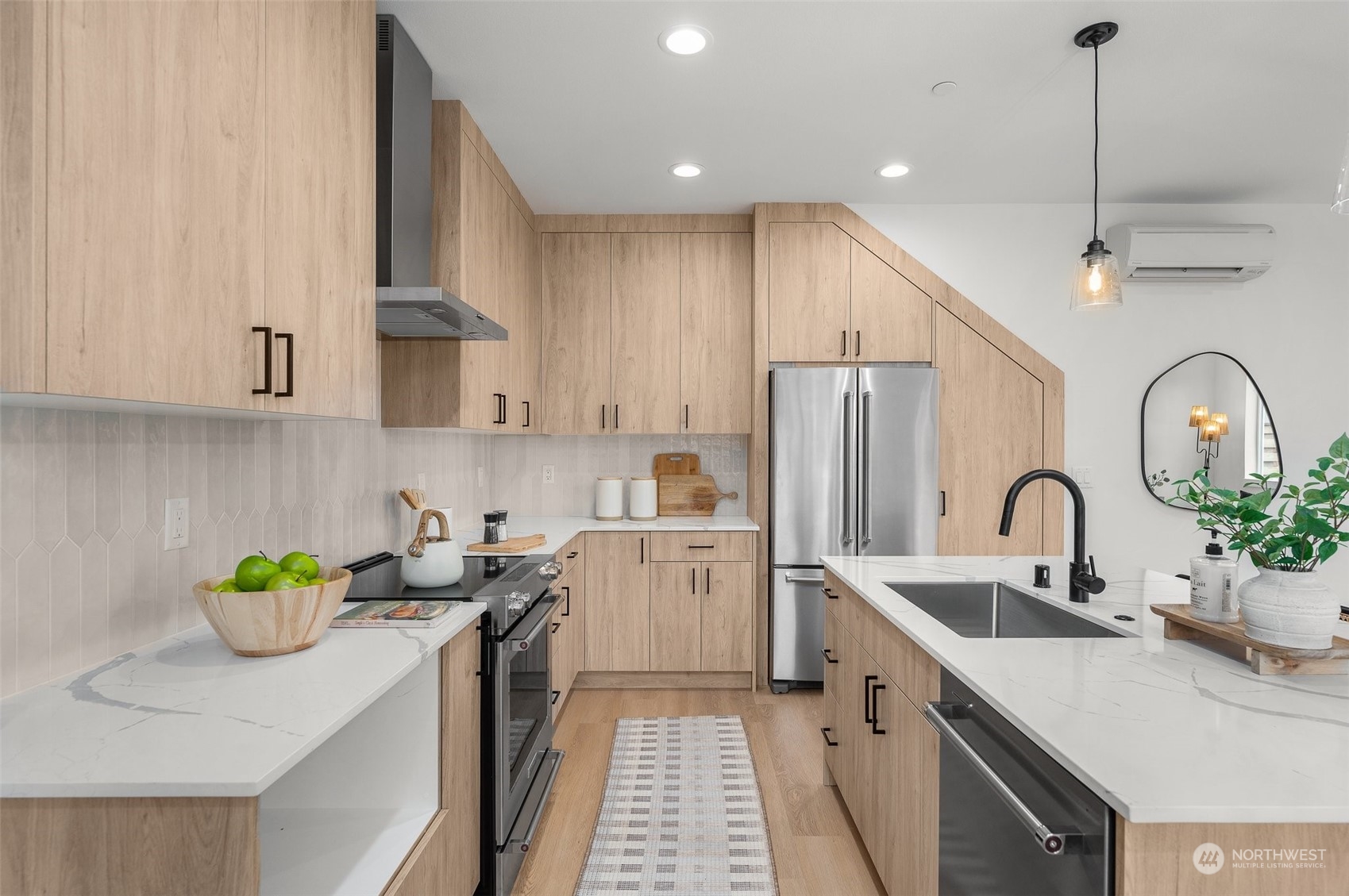 From the contemporary cabinetry to the high-end appliances, this kitchen is a chef’s dream. Thoughtfully placed pendant lighting adds a touch of elegance, illuminating the space for everyday cooking.