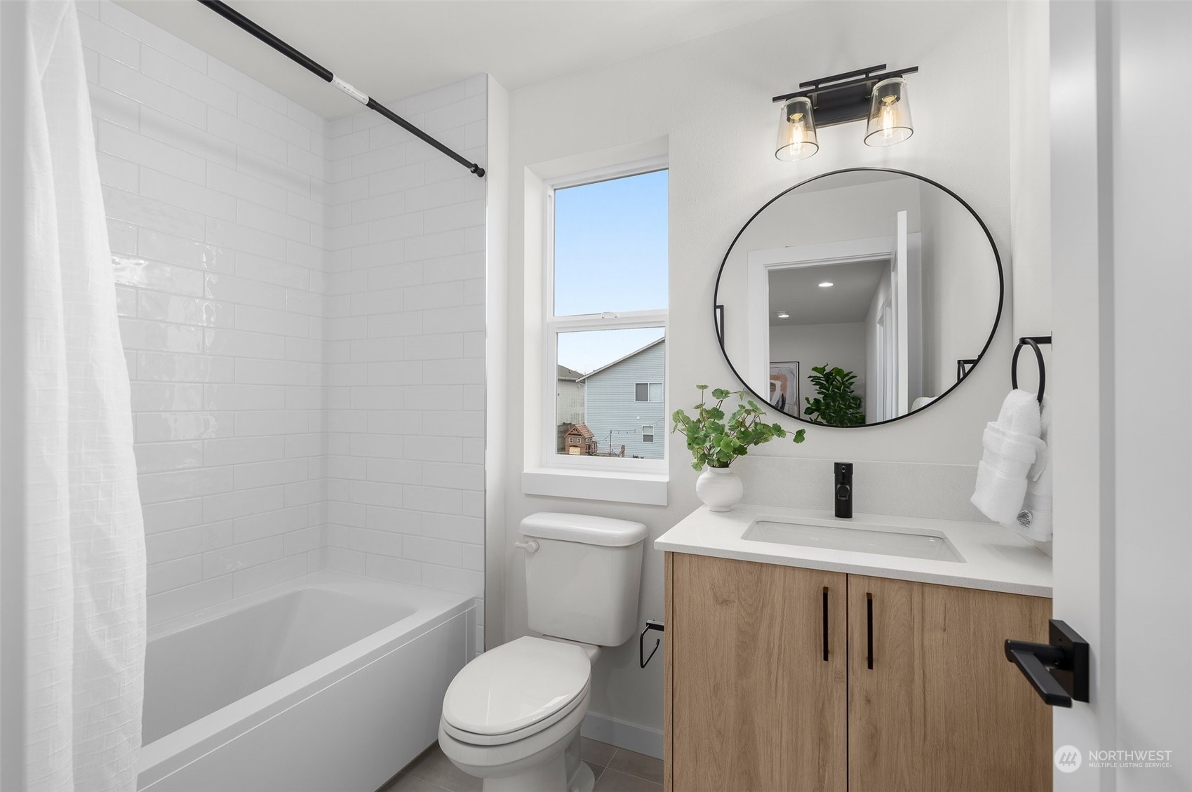 Another angle of this airy retreat! That walk-in closet is calling for your perfectly curated wardrobe, and with plenty of natural light, this space feels even more inviting.