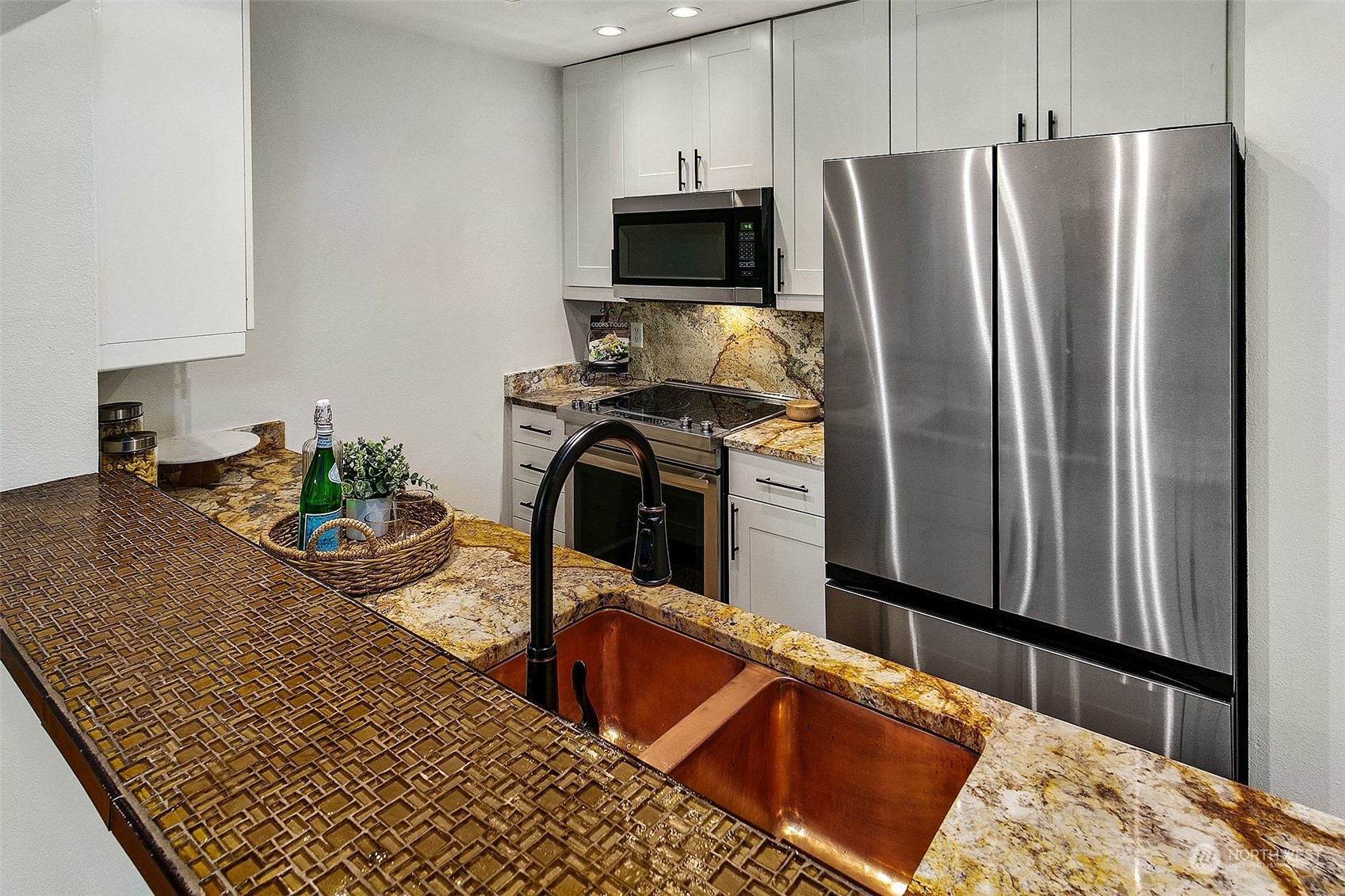 Kitchen is excellent, from the copper sink to the granite counters and newer cabinets and appliances; this is move-in ready.