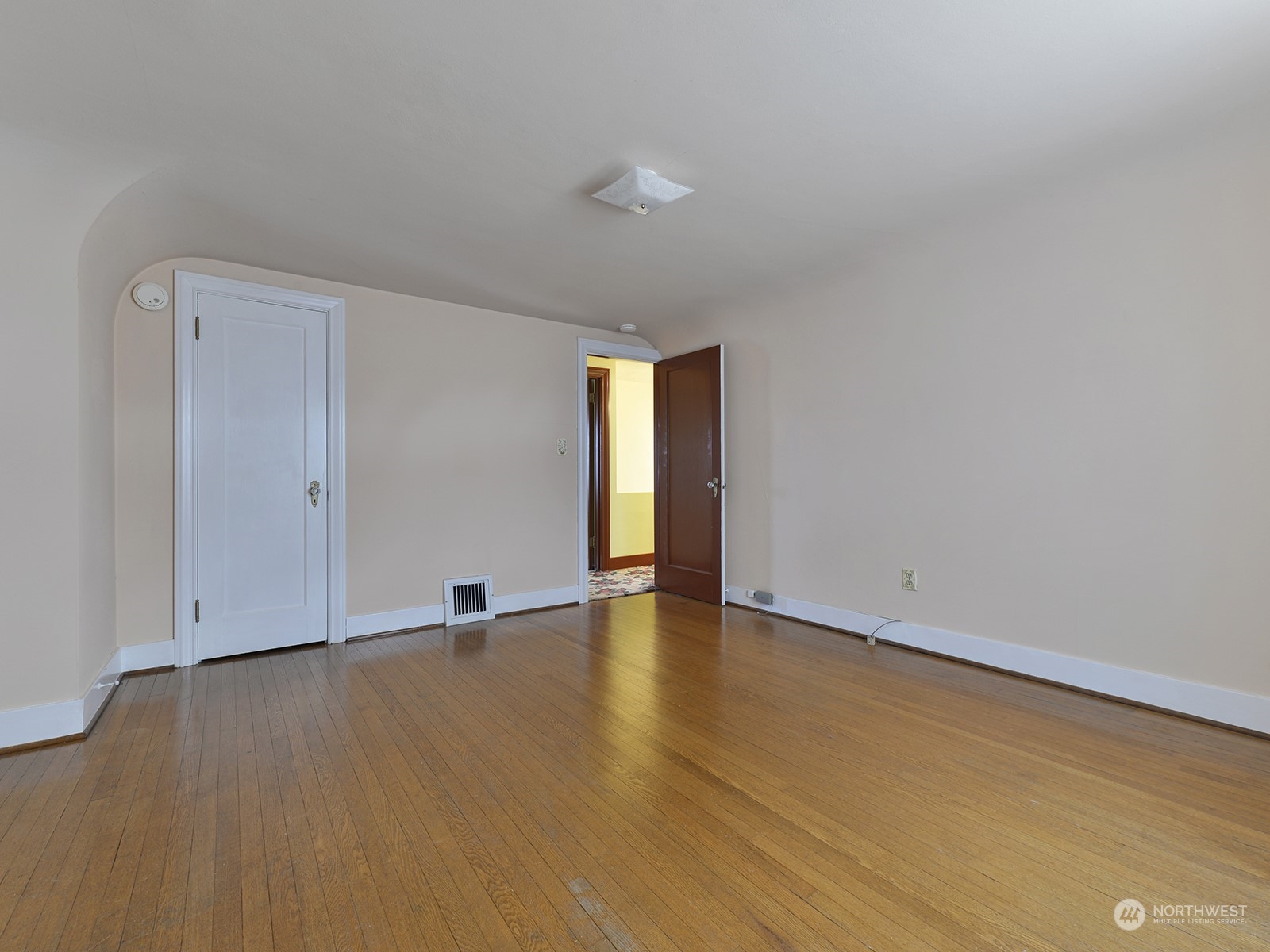 Upstairs bedroom with gorgeous hardwood floors.