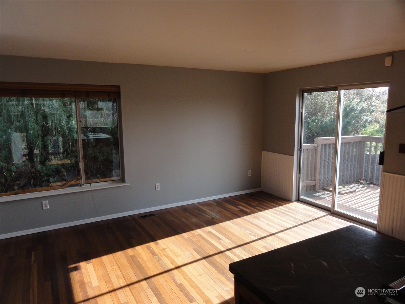 Dining room with sliding glass door to the deck.