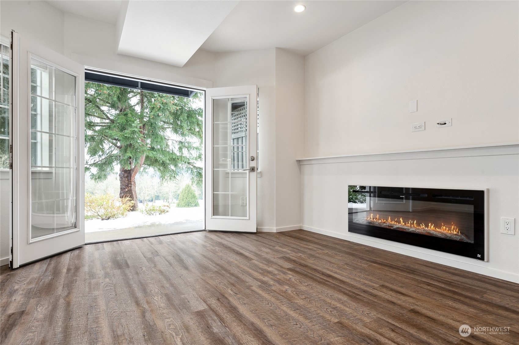 Guest suite with an electric fireplace and french doors that open to it's own private patio.  There is a separate outside entrance to this area.