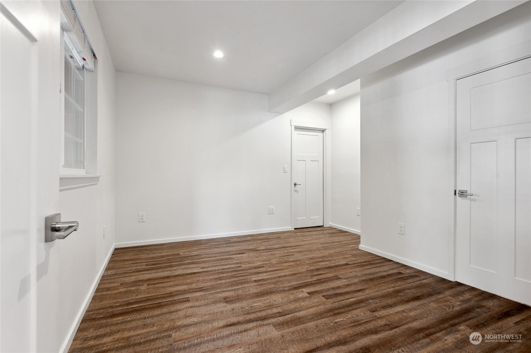 Guest suite bedroom with a walk-in closet and the door on the back right wall opens to the storage room.