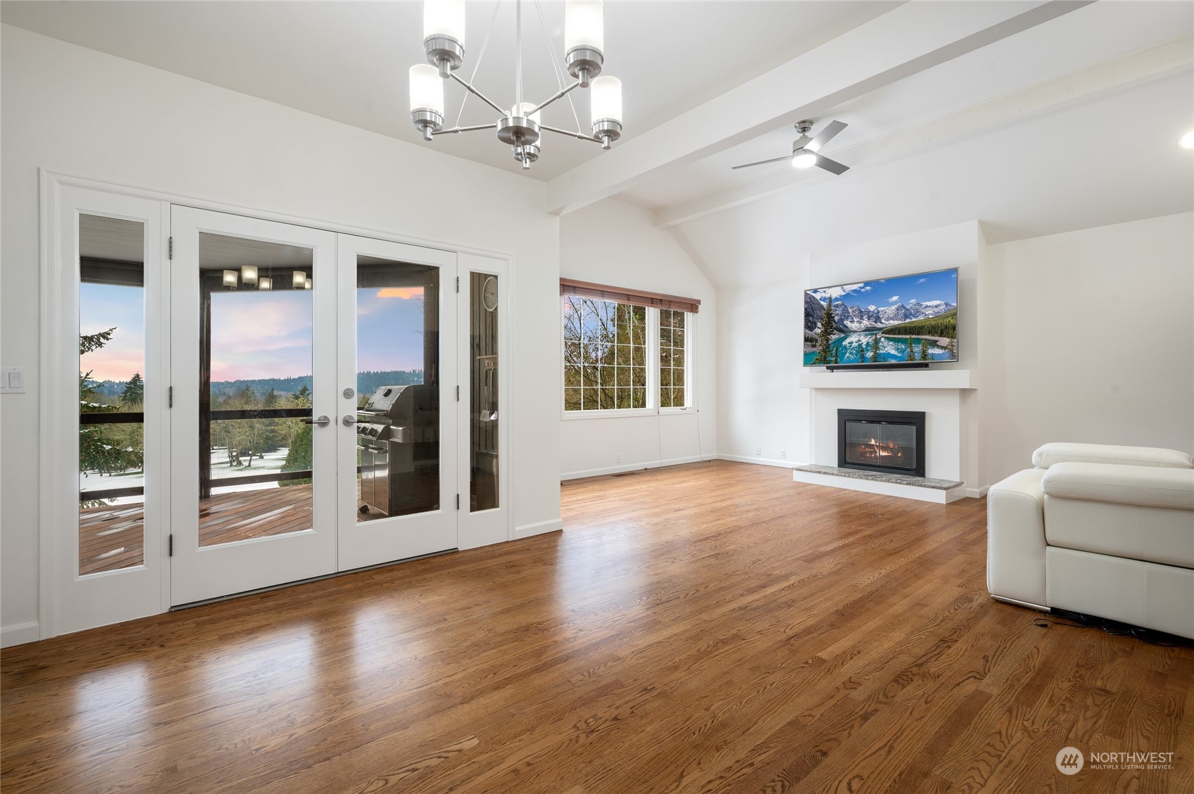 Family room & dining area with french doors that lead to the dekc.