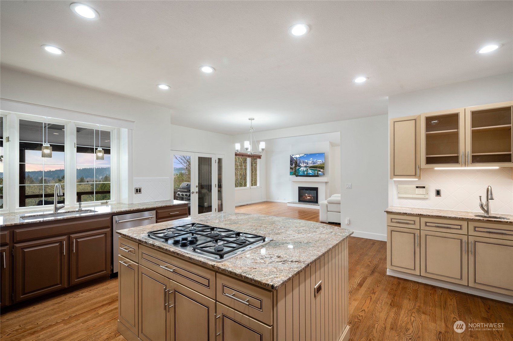 View from kitchen to family room and French doors to deck.