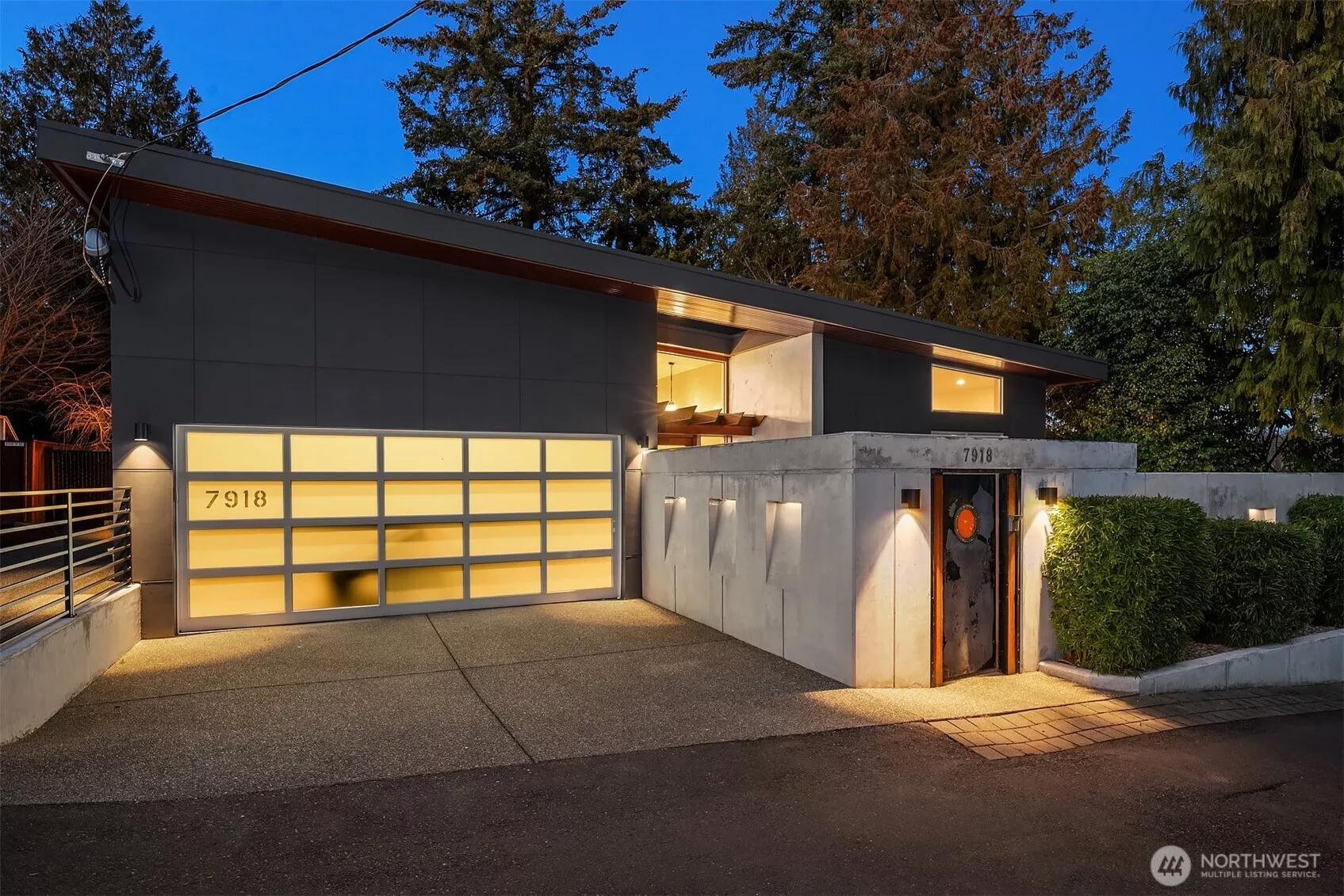 A Modern Boho Sanctuary in the Heart of the City! Step through the steel-framed gate with salvaged ship porthole, and you're immediately transported into a hidden courtyard, a secret oasis where lush greenery and architectural elements set the tone for the home’s serene ambiance.