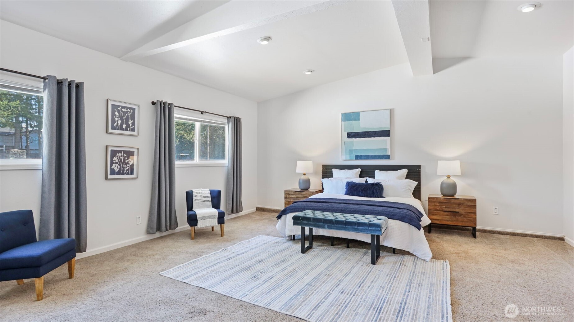 So much room in this primary for all of your bedroom furniture, plus room for sitting area!