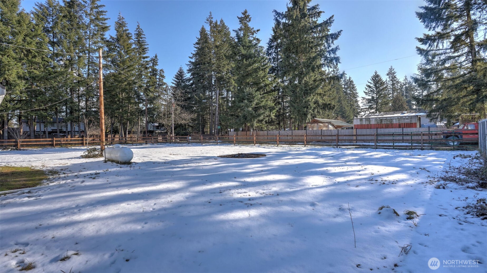 Step outside to the covered back patio overlooking the large backyard.