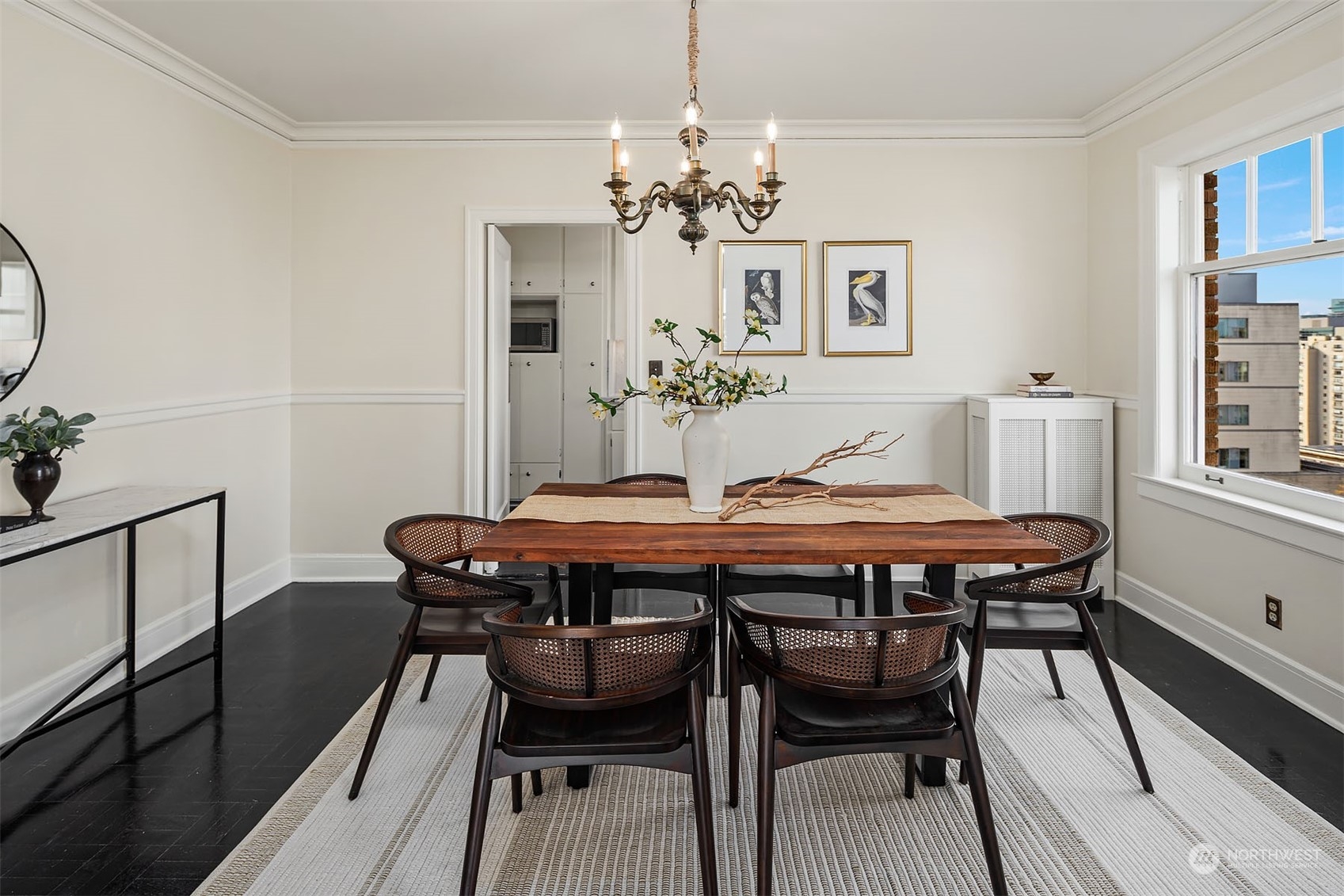 While open to the living room, this is a true, stand alone dining room - featuring another lovely period chandelier.