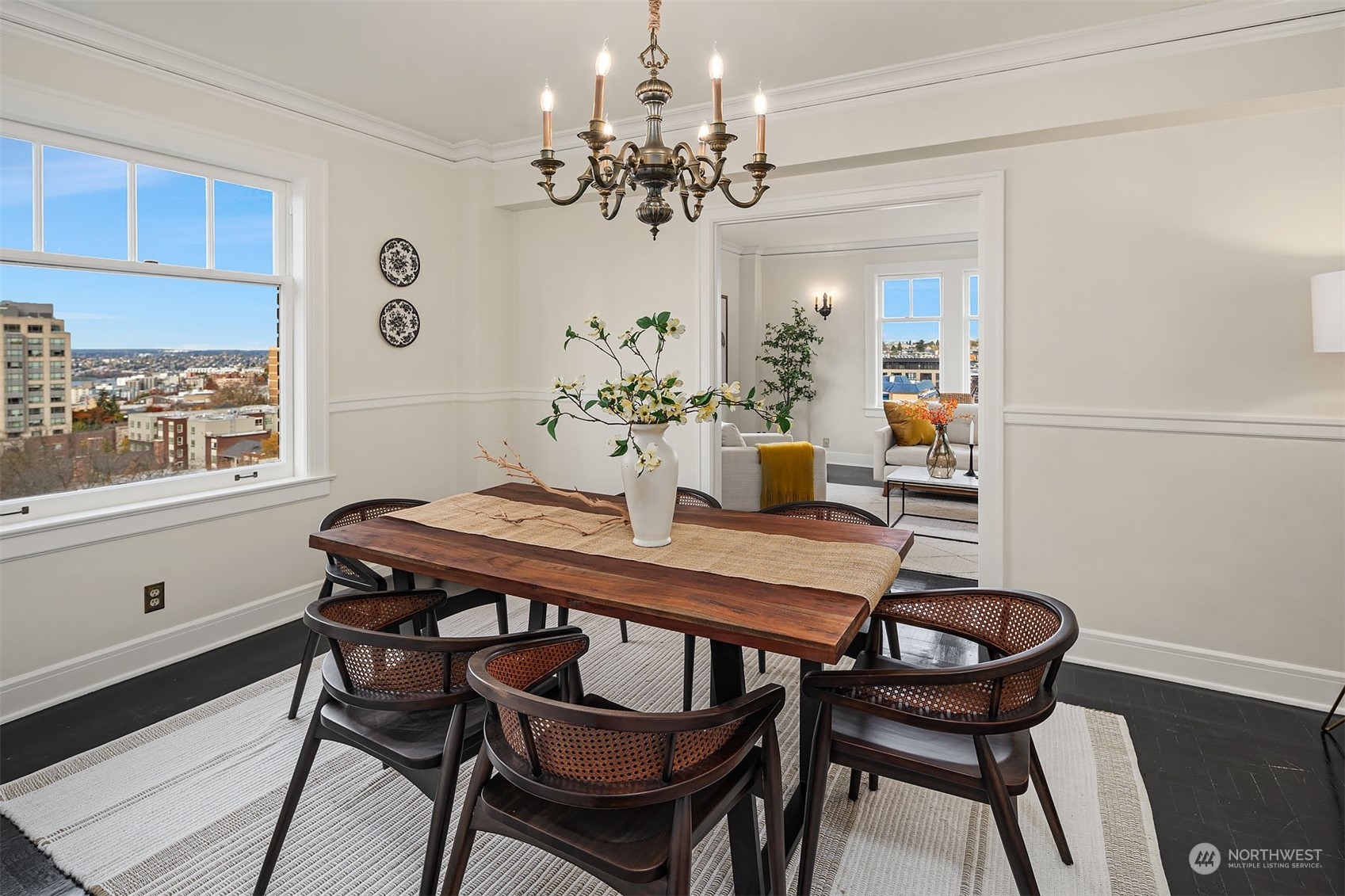 While open to the living room, this is a true, stand alone dining room - featuring another lovely period chandelier.