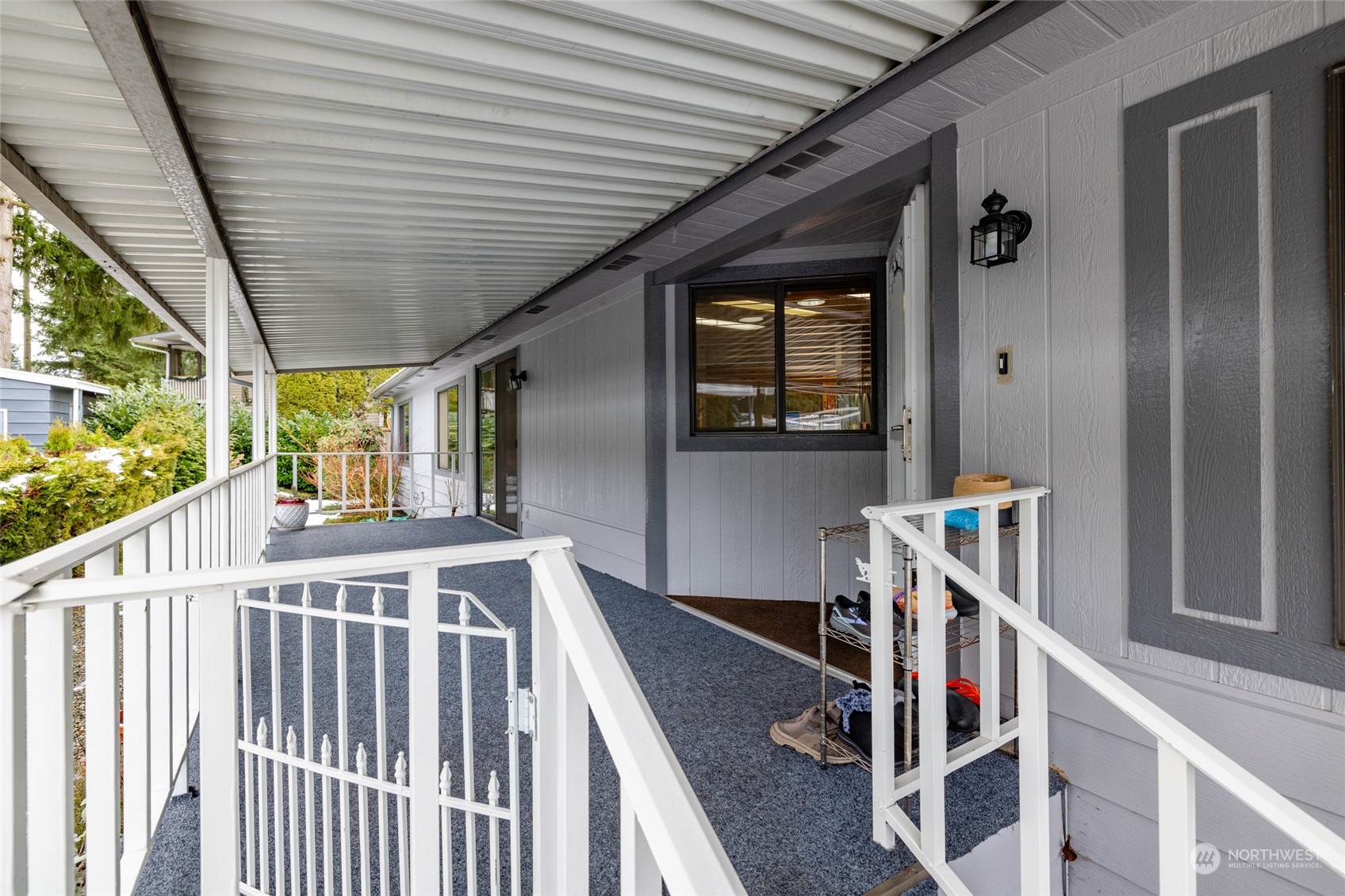 Generously-sized covered entryway and sitting porch