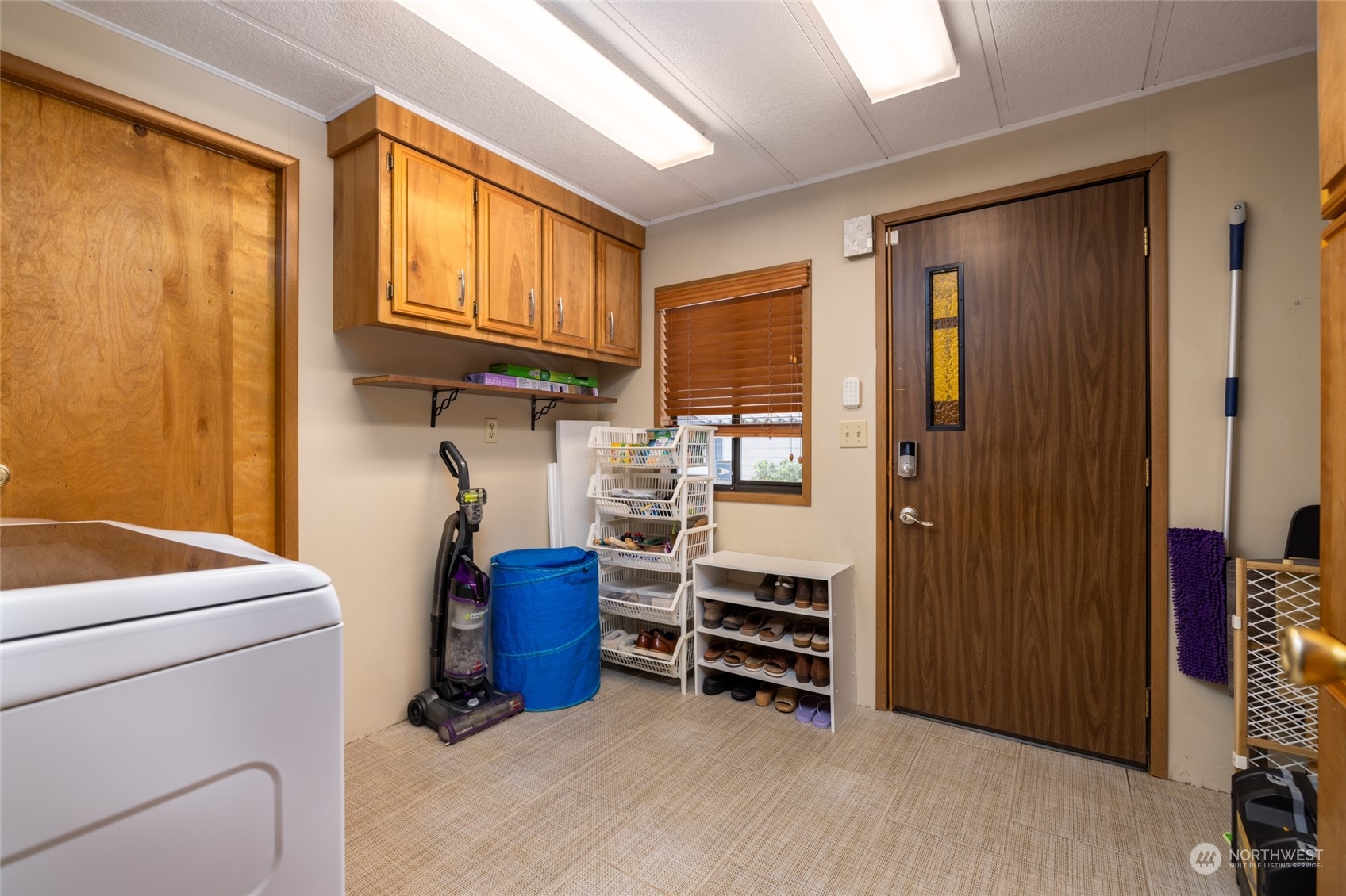 spacious utility room with tile floors.  Washer and dryer new in 2023