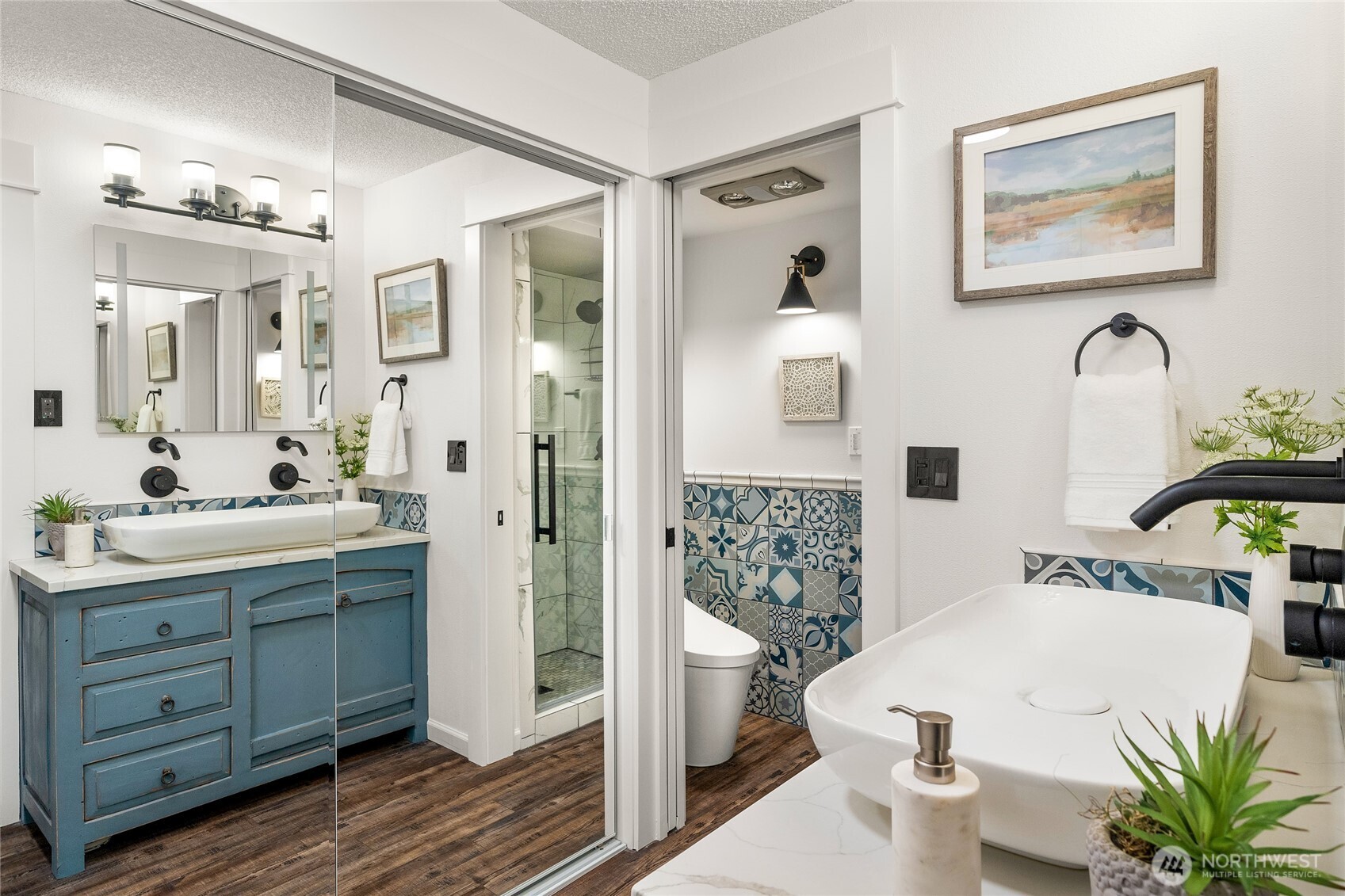 The primary bath was completely remodeled in 2023 - dual vanity, flooring, tile, plumbing, slimmer toilet and new shower were added. 2 closets make this a very usable suite.