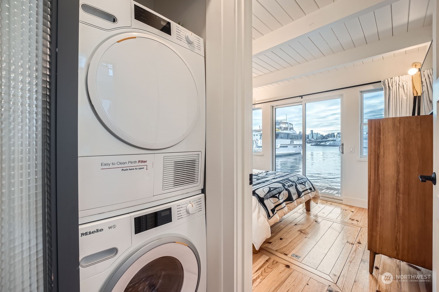 You will love the Miele washer/dryer. So smart... Also, visible here is the hatch to the cargo hold which is approximately 4' deep and the width and length of the hull. Tons of storage space and access to all the mechanical systems and plumbing ...