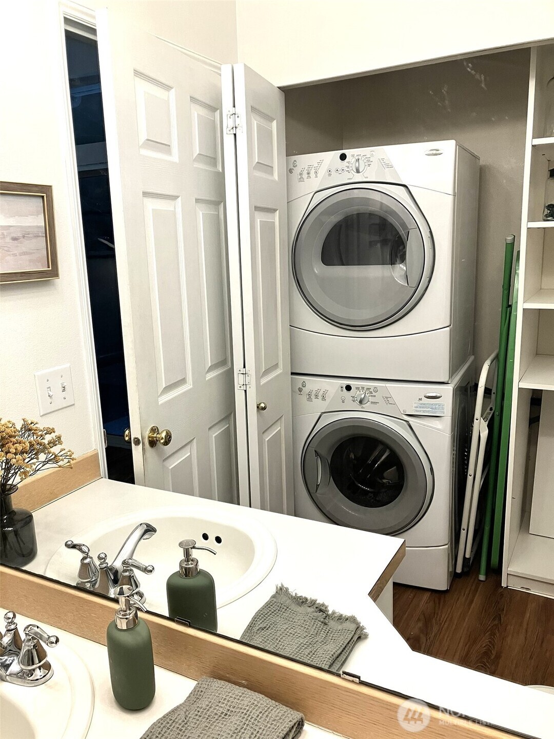 Utility close in main level bathroom includes washer, dryer and plenty of storage