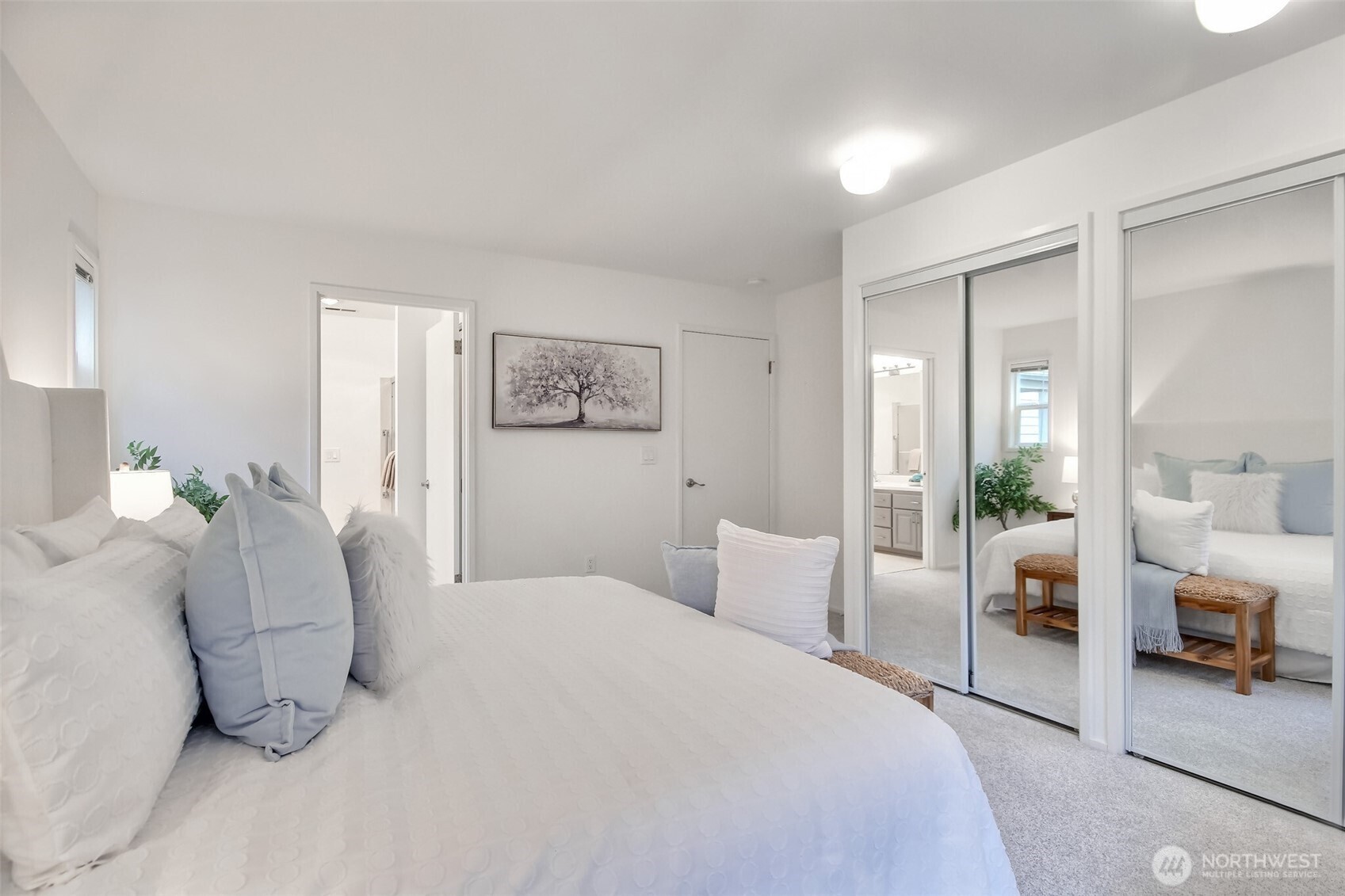 Primary bedroom suite with new dual closet bedroom doors.