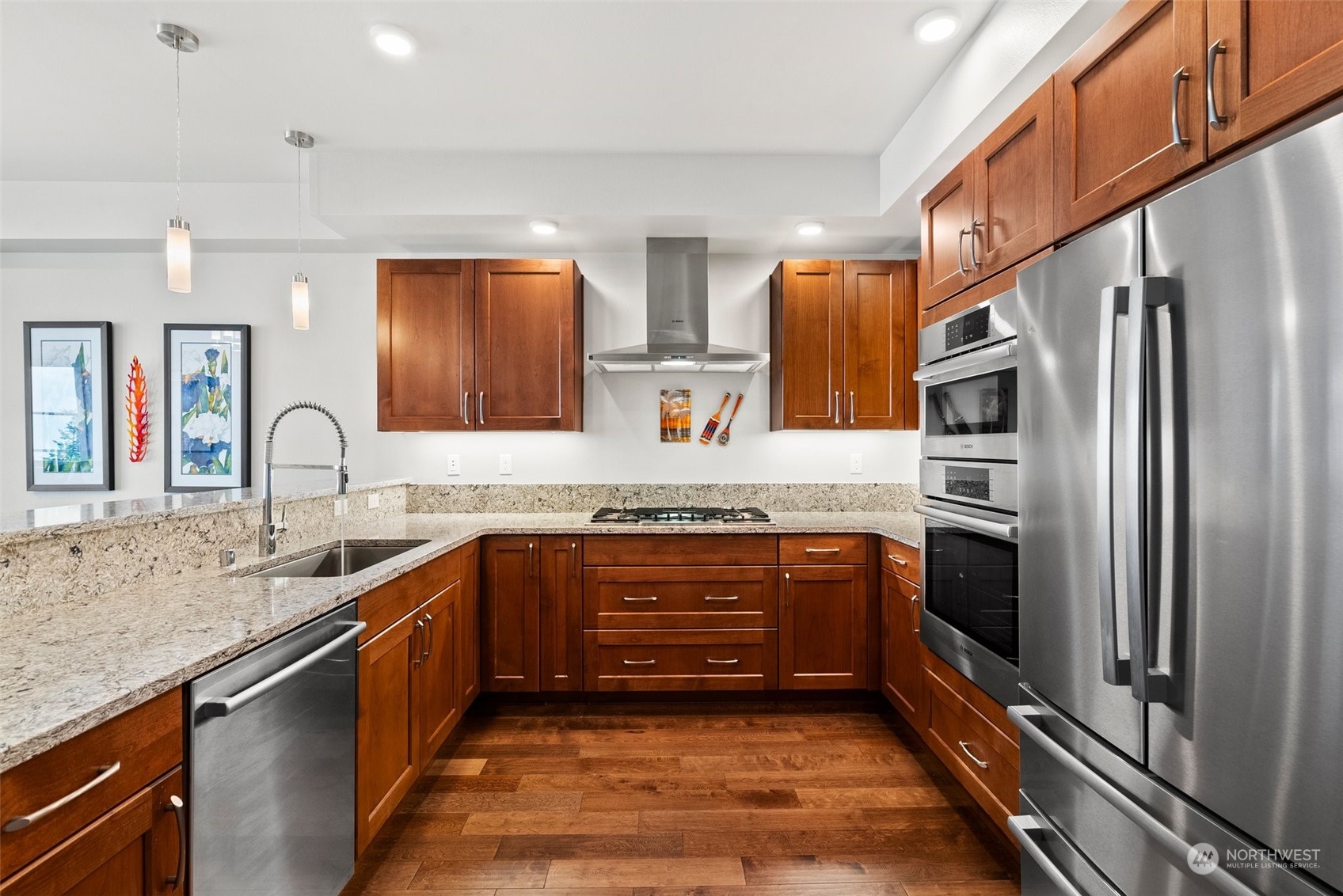 Chef's kitchen features Quartz counters & stainless Bosch appliances (including convection/microwave& gas cooktop)