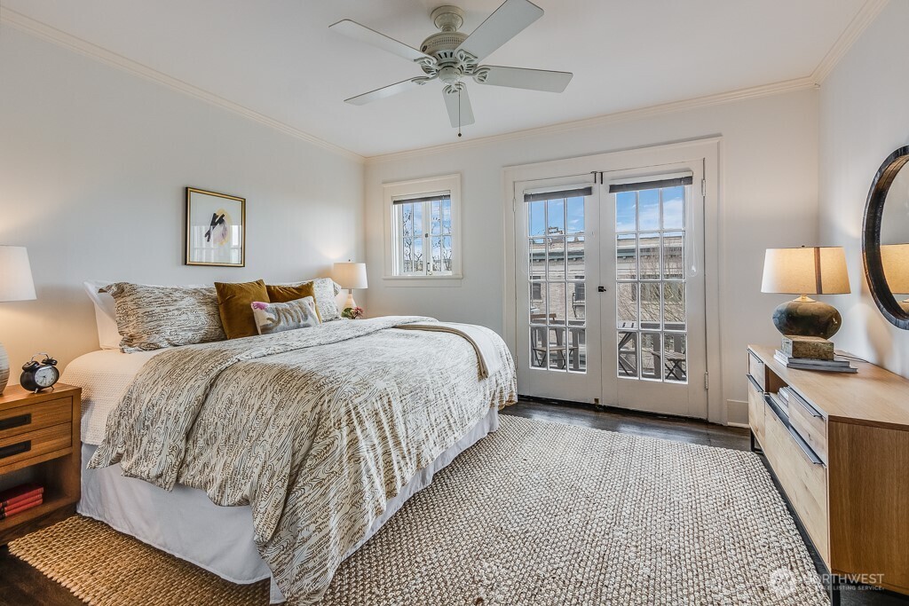 The bedroom is spacious. The bed featured here is a king. The French doors lead out onto a patio, another rarity in vintage condos and co-ops.