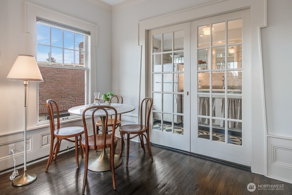 The French doors to the kitchen slide into the walls.