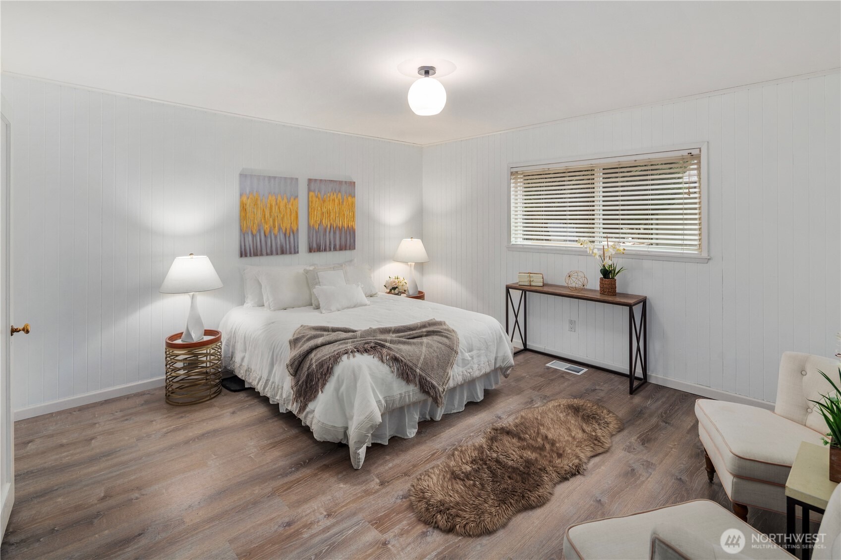 The primary bedroom is spacious enough for chests of drawers, or for a reading nook, extra chairs...whatever you'd like!