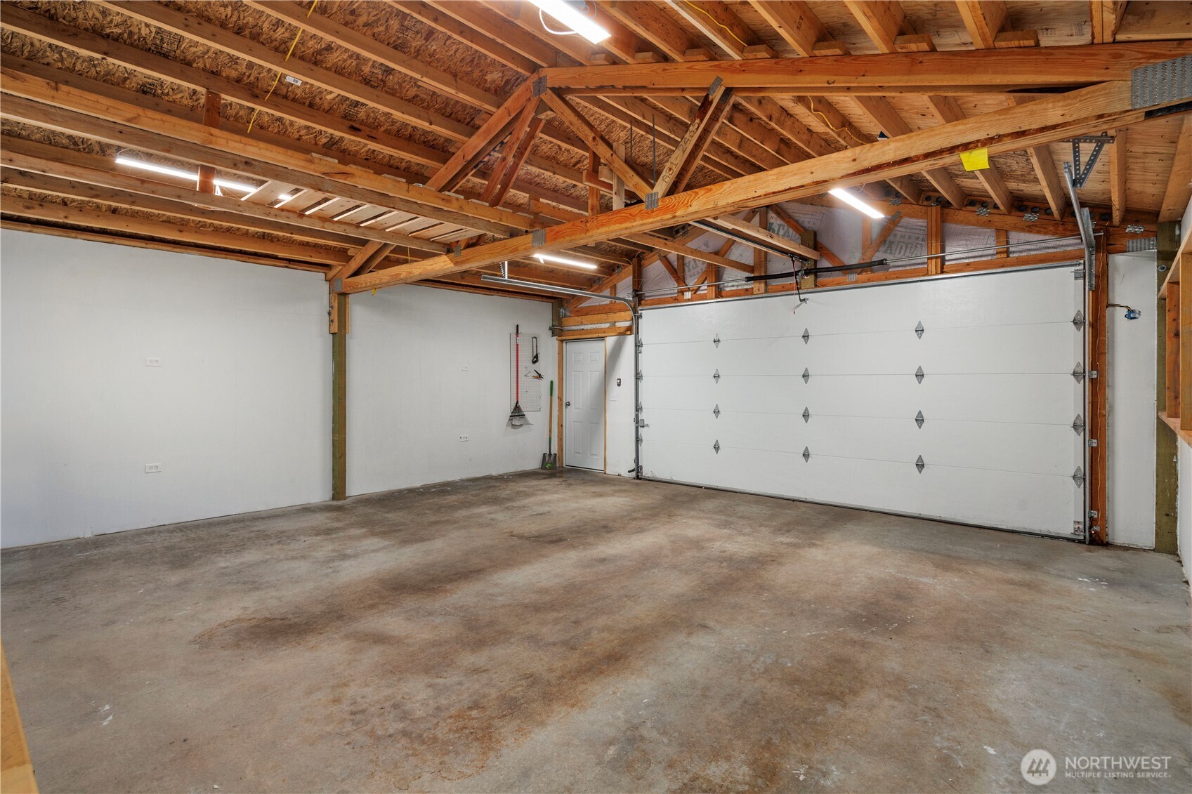 The clean and spacious oversized garage can also be used for a shop space if you so desire!