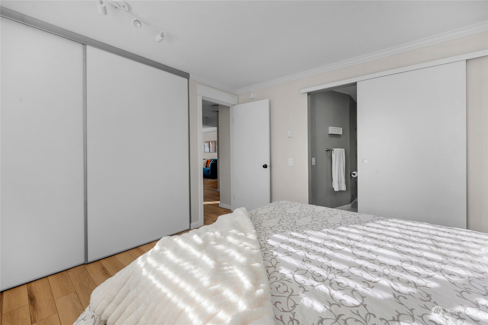 Primary bedroom alternate view, check out the oversized closet and the stylish barn door leading to the spacious 3/4 bathroom