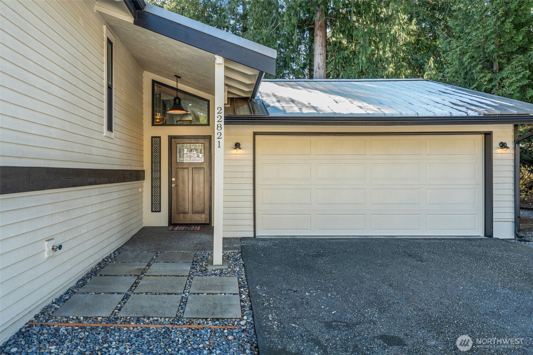 The inviting entryway showcases thoughtful details and stylish updates, setting the tone for the rest of the home. Notice the updated roof that will last you for 50+ years!