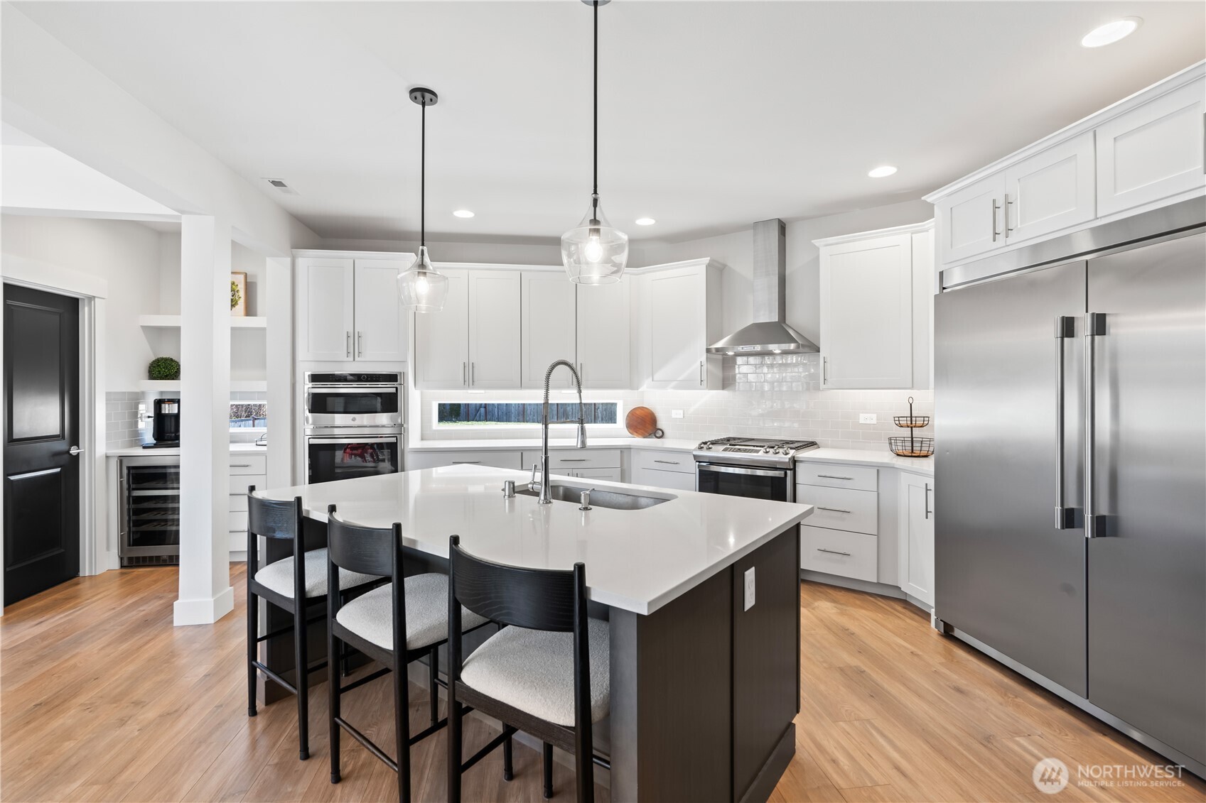 Living room flows seamlessly into the chef's kitchen