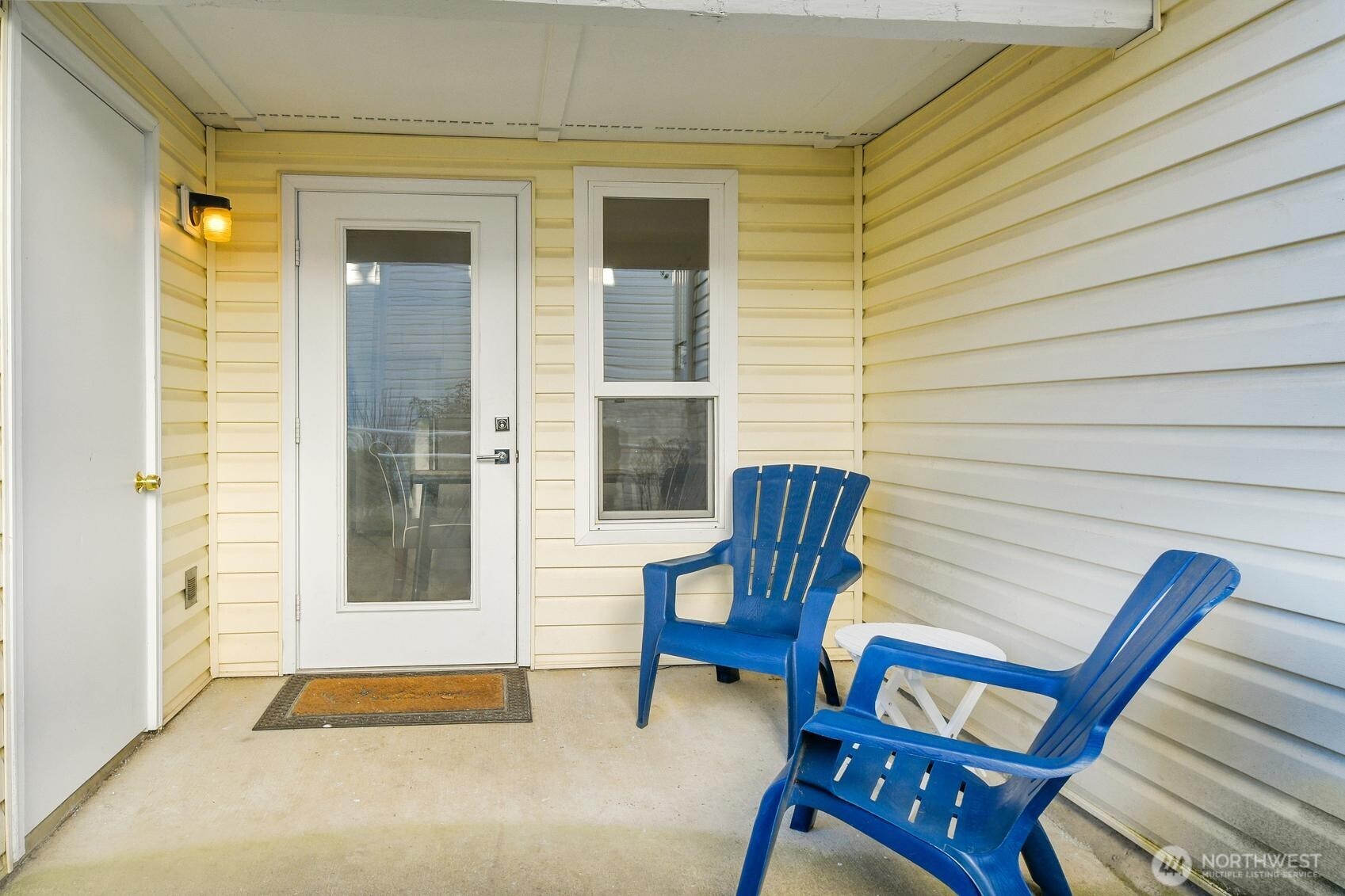 Nice size covered patio with space for a table. The door on the left opens to the storage unit.