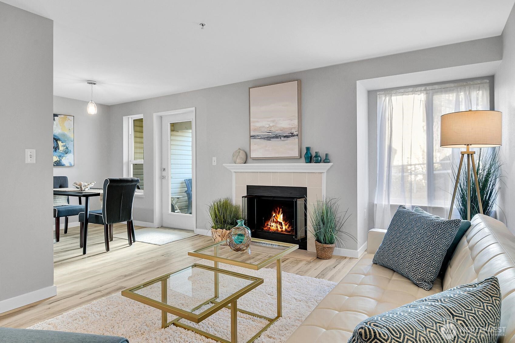 Formal dining with space for a full size table and a pleasant outlook to the patio and beyond.