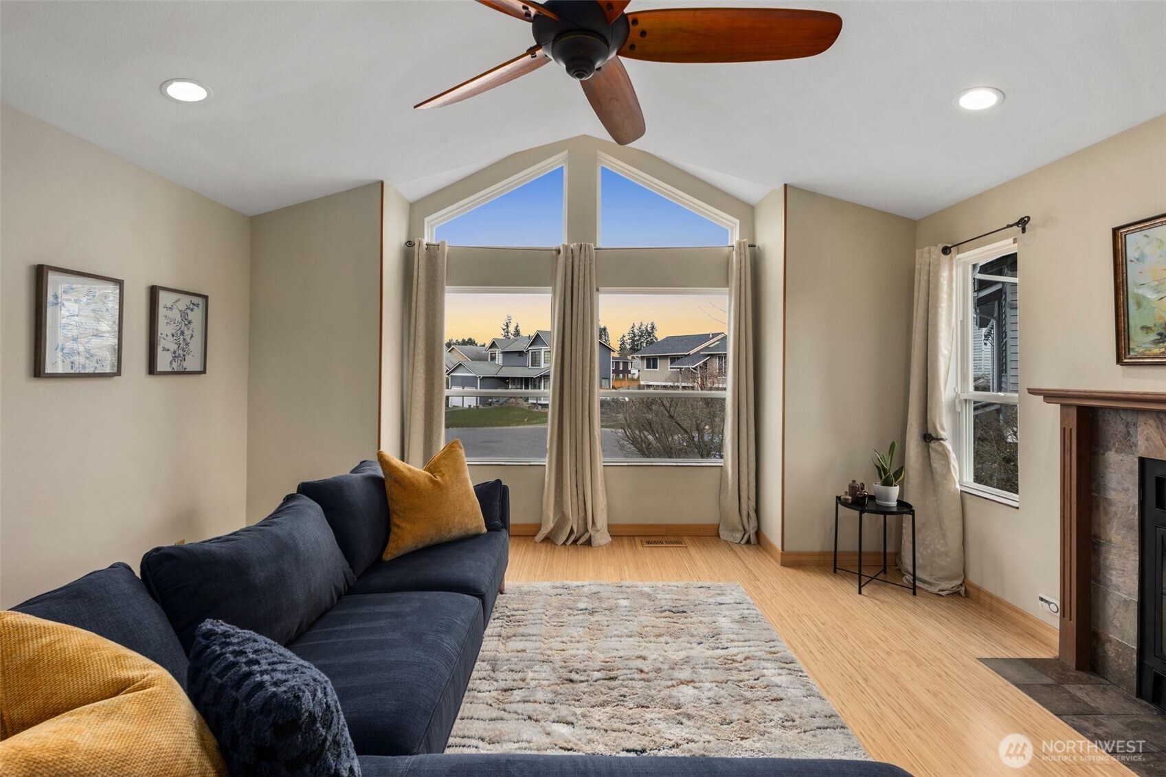 Vaulted cielings in living room really open up to the big windows and natural sunlight