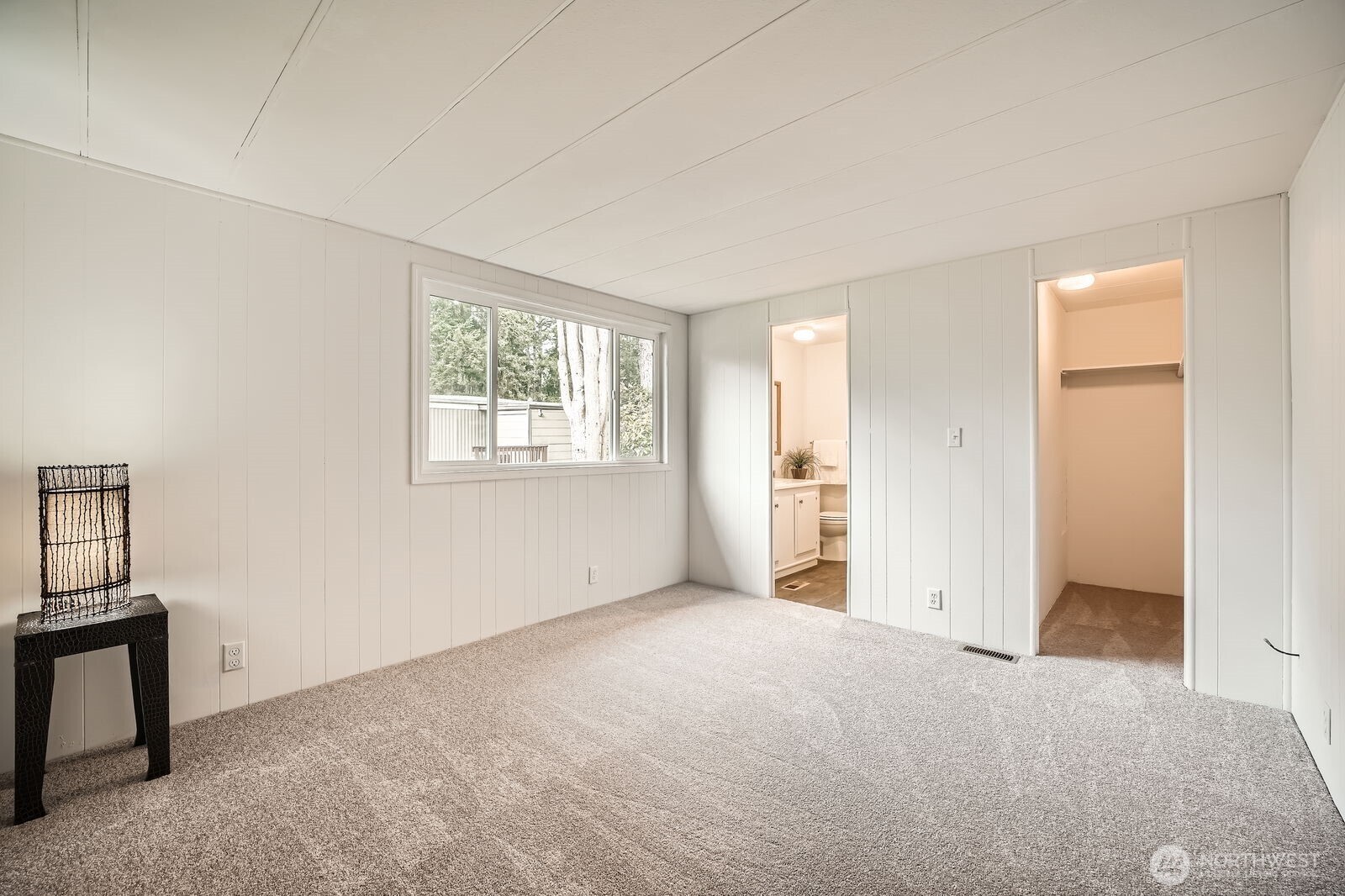 Primary bedroom has ensuite bathroom with walk-in shower, and a walk-in closet