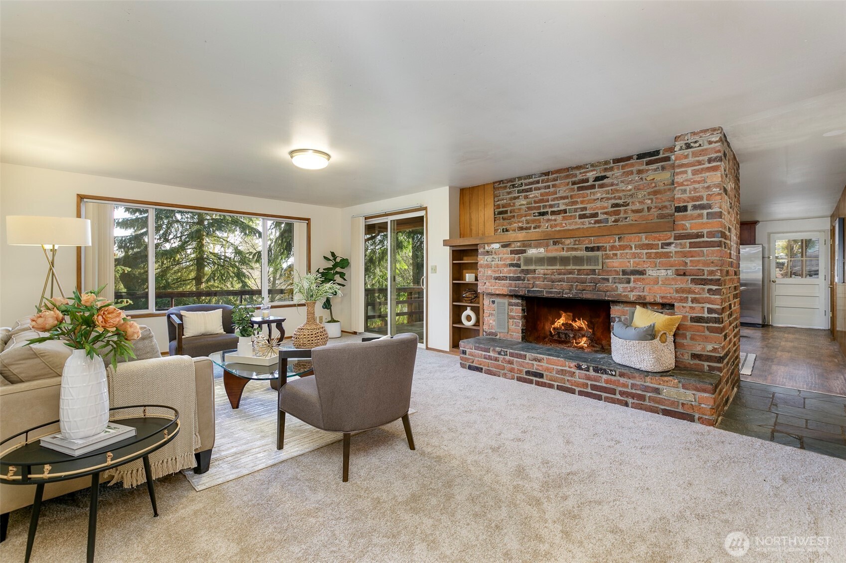 Living Room with Fireplace and View of Kitchen