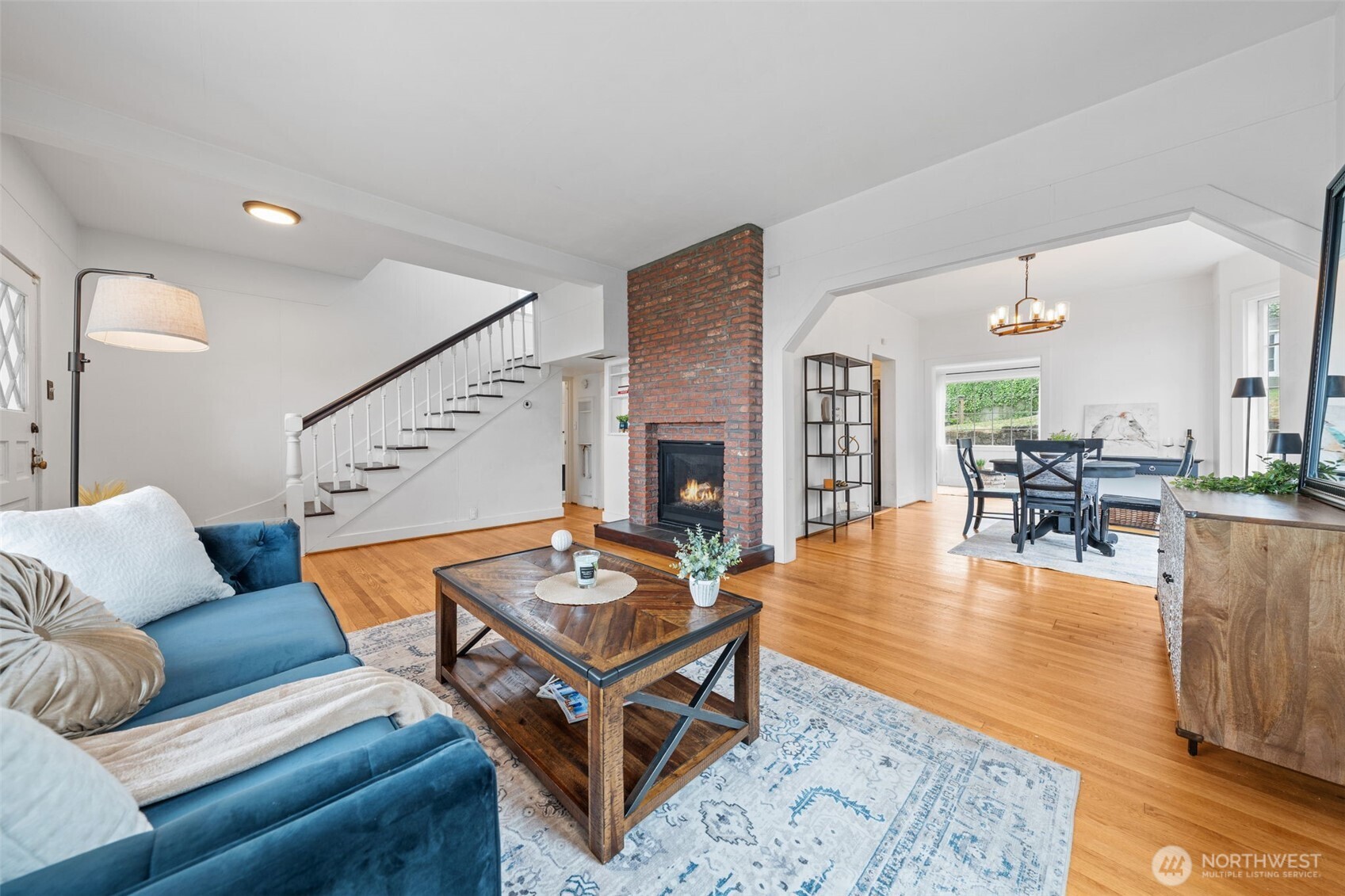 Spacious living room with original hardwoods throughout.