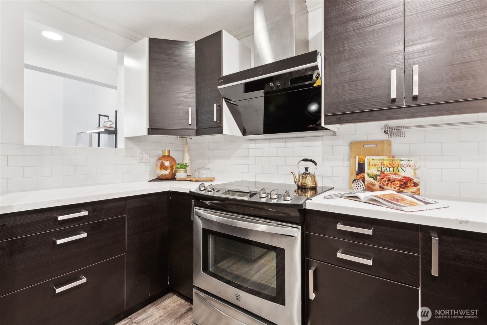 Kitchen (remodeled), featuring a professional vent hood