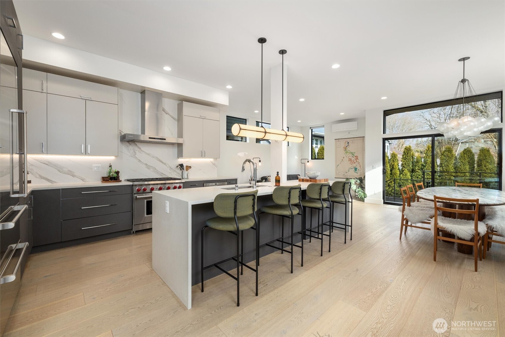 **Gourmet Kitchen & Entertaining Spaces:** The heart of the home boasts a stunning gourmet kitchen featuring top-of-the-line appliances and sleek cabinetry.