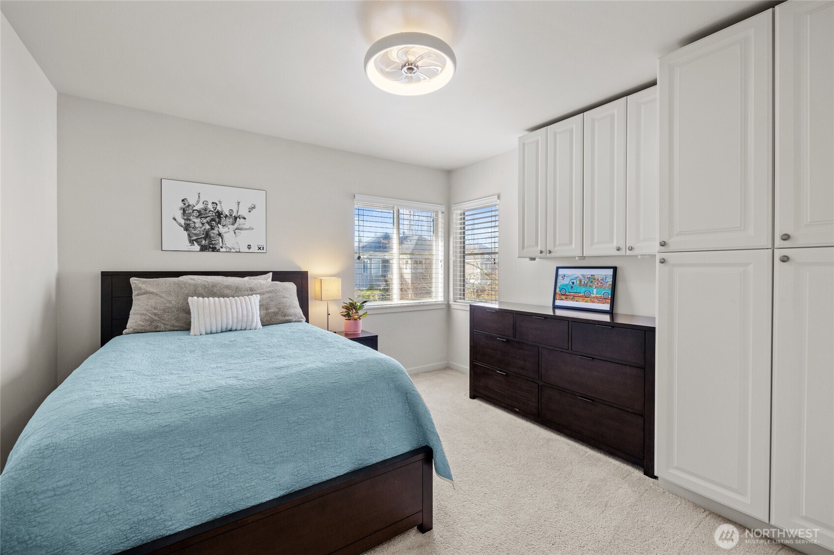 2nd bedroom with built-ins and corner windows