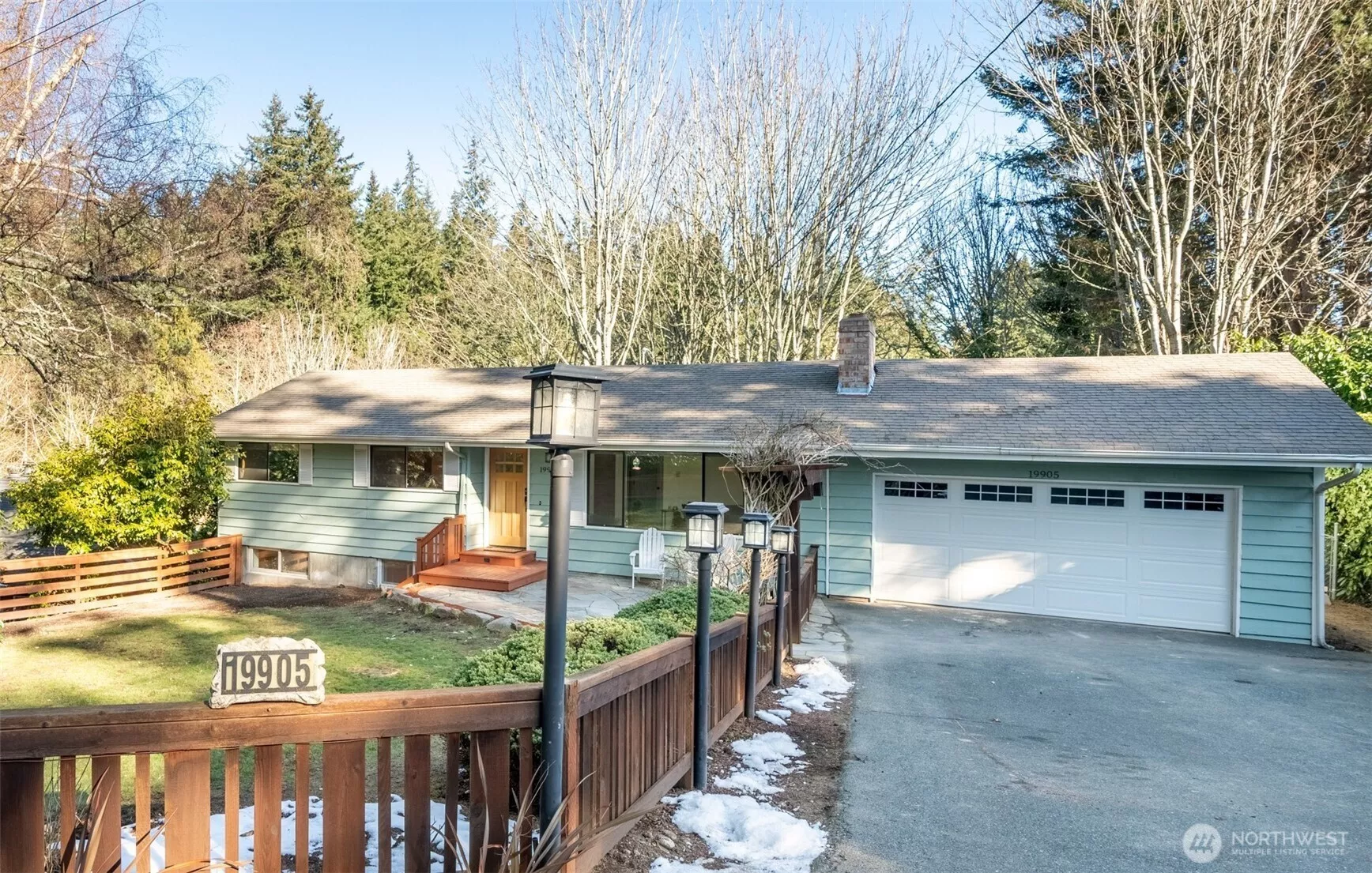 Completely remodeled mid-century daylight rambler on greenbelt. New lights along driveway and under eaves.