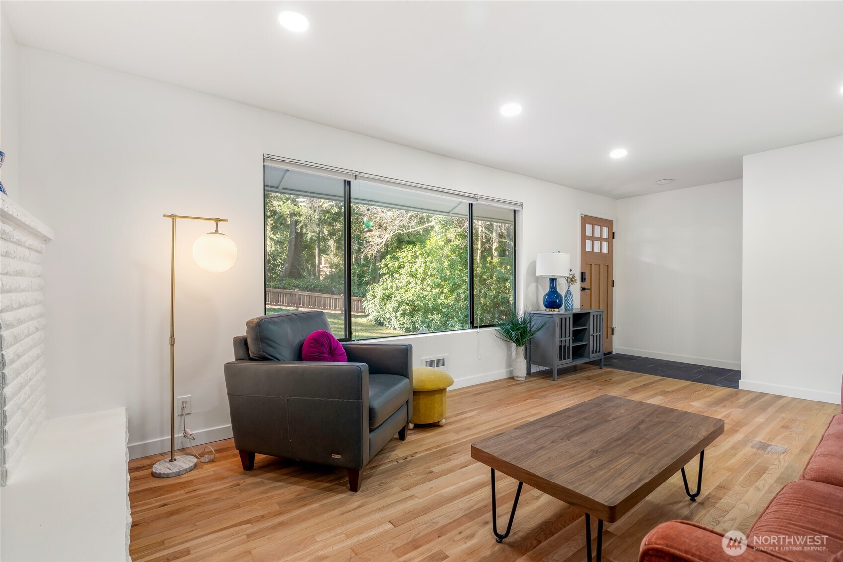 New baseboards, heating, can lights, and front door with keypad lock.