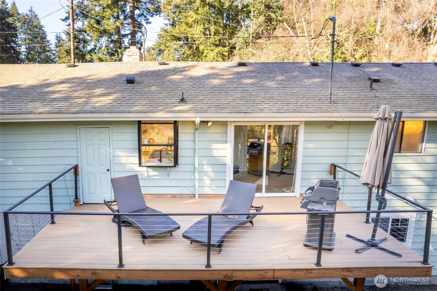 Main-floor deck overlooks greenbelt to the east.