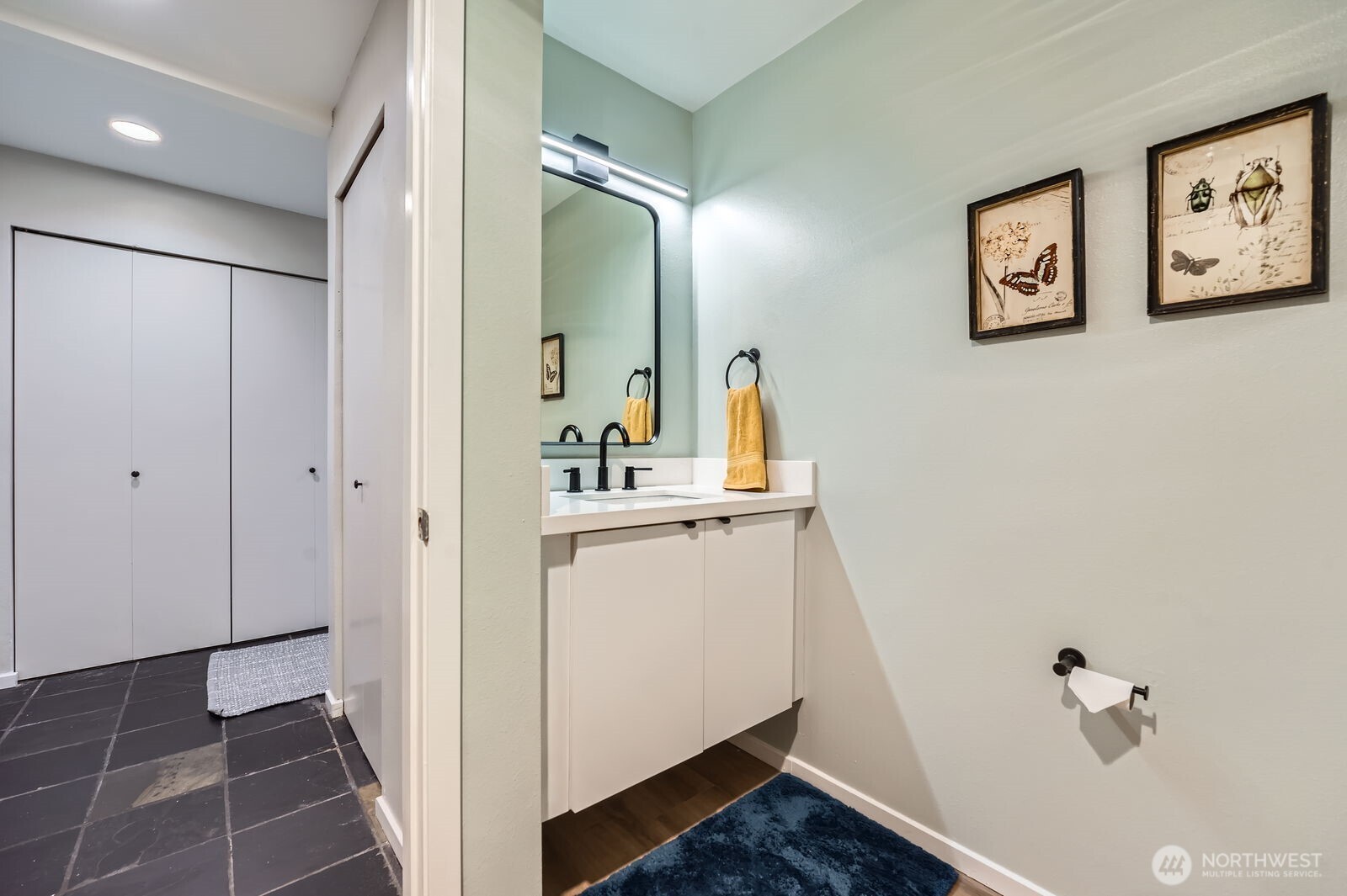 Updated bath with Lux Vinyl flooring, new vanity and lighting!