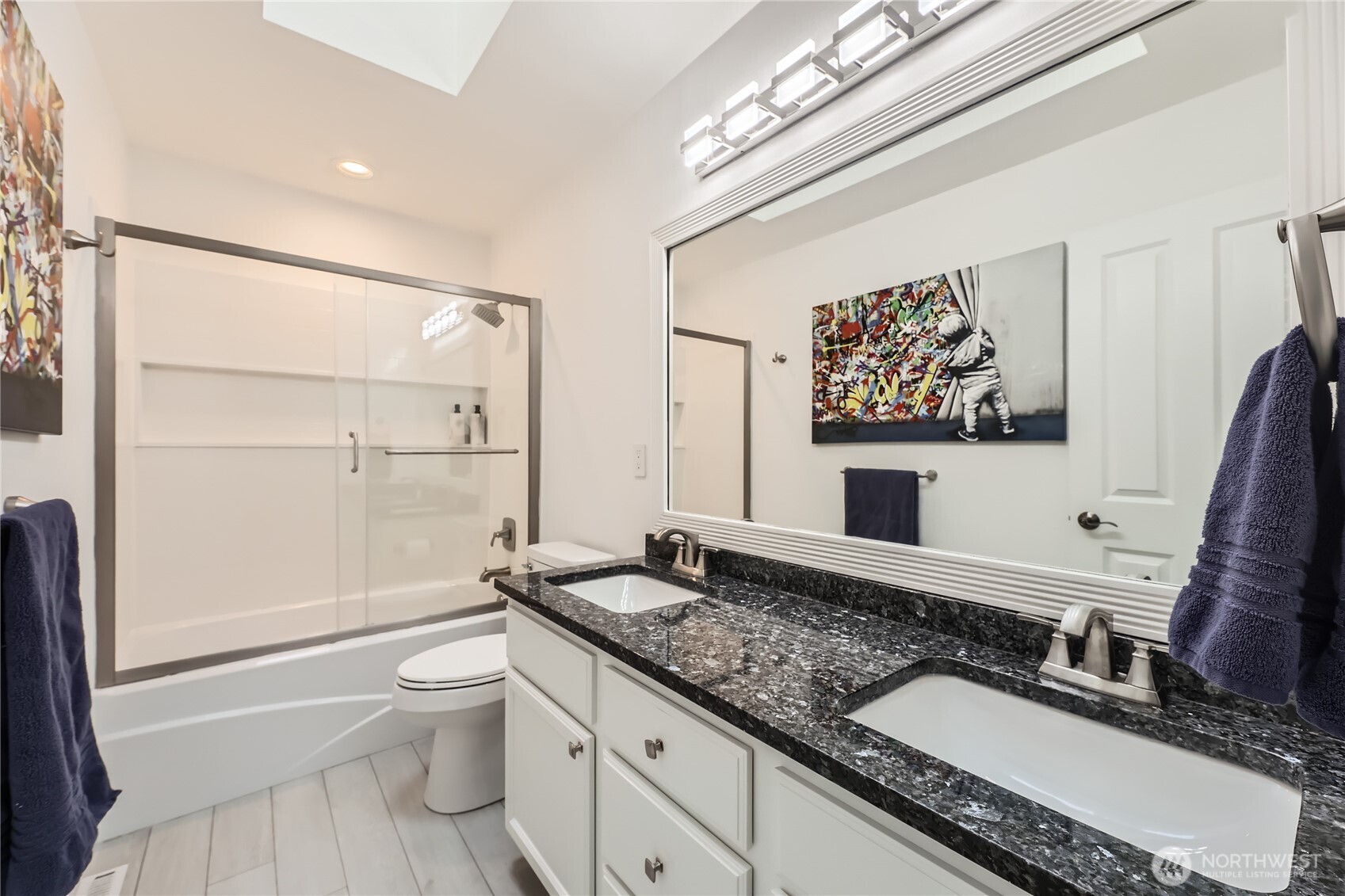 The second bathroom features a new tub, shower, upgraded screen flooring, LED lighting controlled by Alexa, and an extractor fan with a Bluetooth speaker.