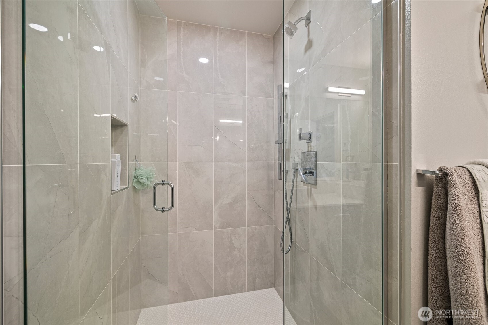 Gorgeous glass and marble tile shower