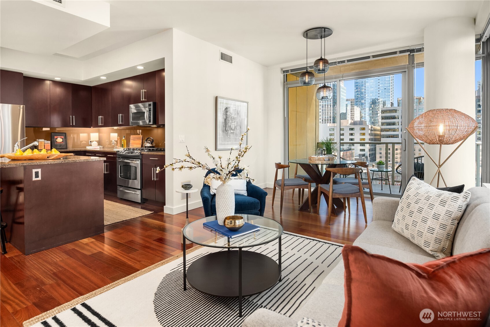 The main living and dining room are separate but open to the kitchen for great entertaining. The deck is just beyond the dining room table.