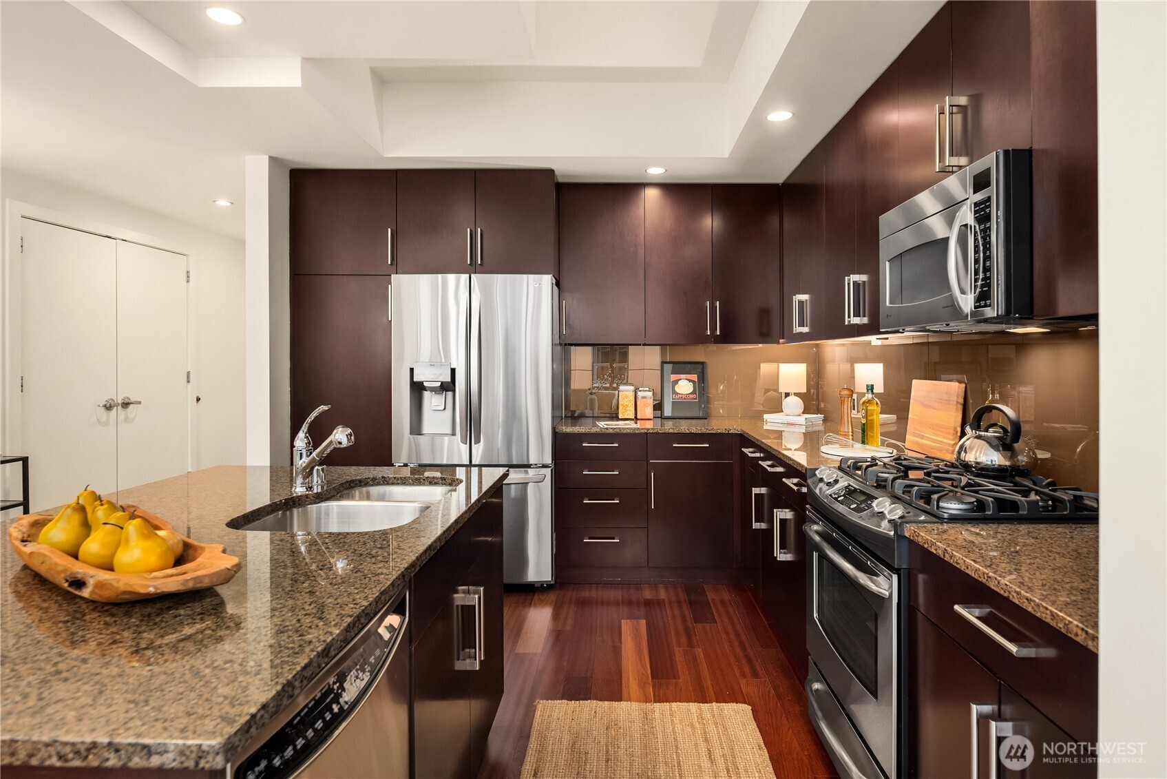 Great storage and counter space. A built-in microwave is just above the gas stove.