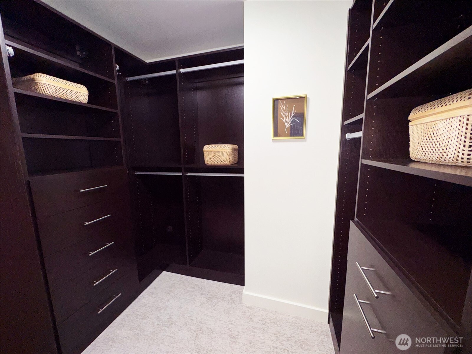 The second bedroom is equally stunning with a full wall of California Closets shelving. A spacious closet is off to the right.