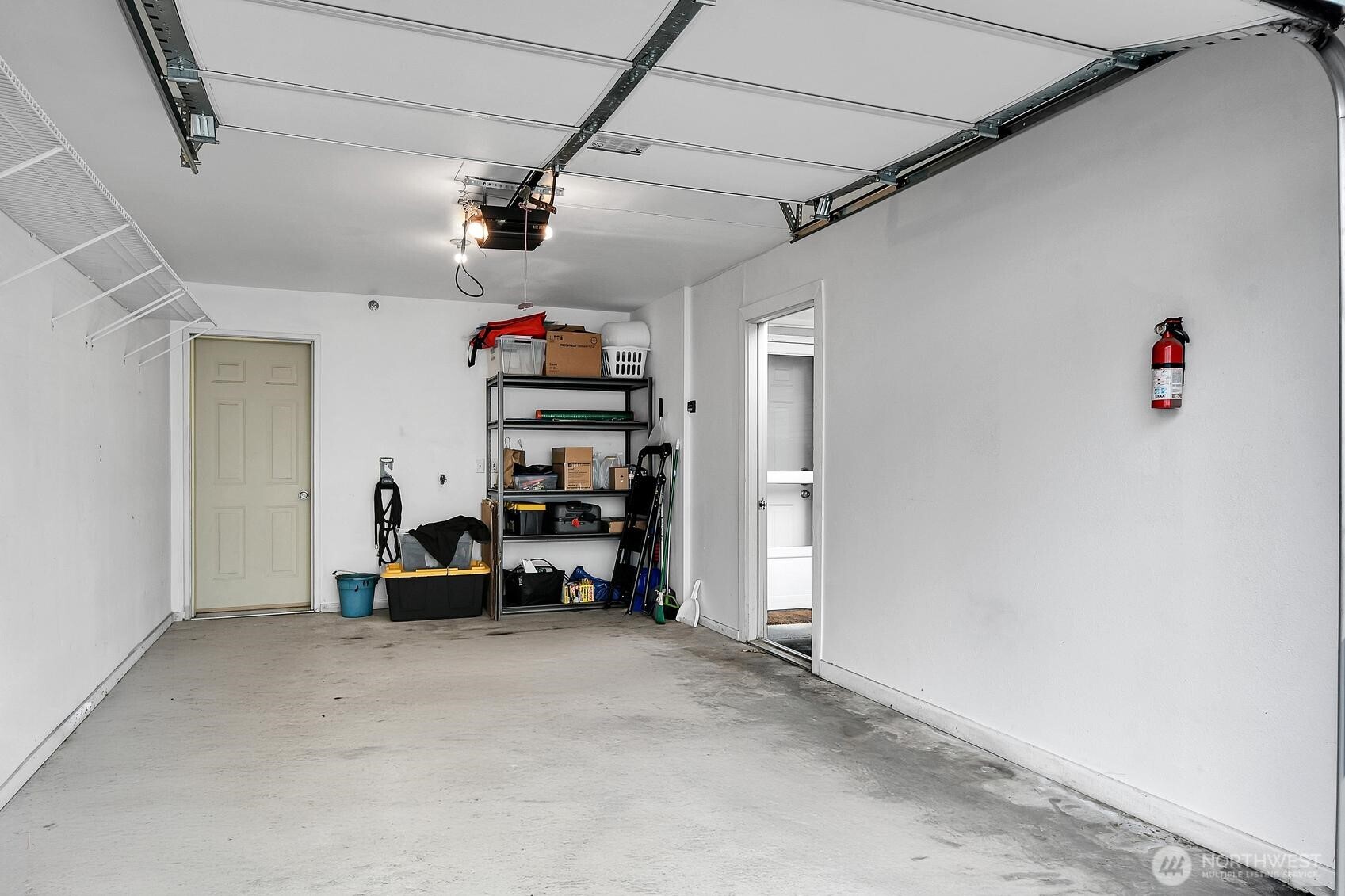 Attached garage with some extra storage space.